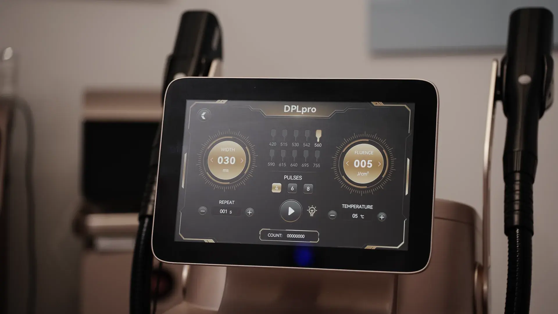 A treatment machine with a touchscreen showing two dials